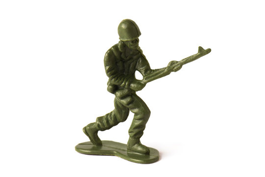 Running toy soldier carrying a rifle gun, isolated on white background
