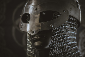 berserker, helmet of viking warrior with mail on coat of arms with drawings and viking symbolism,...