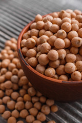 uncooked chickpeas on a wooden rustic background