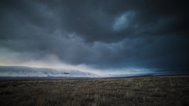 Time lapse of an evening thunderstorm rolling over an open field in rural Wyoming