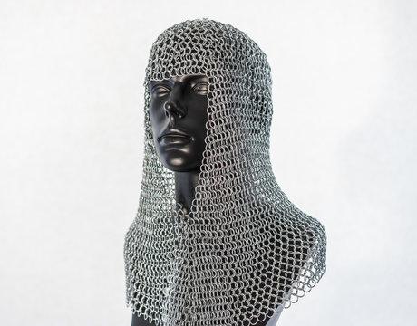 Metal, Viking helmet with chain mail in a black mannequin on white background. clothes for the viking war