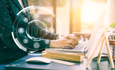 Cropped image of professional businesswoman working at her office via laptop, young female manager using portable computer device while sitting at modern loft, flare light, work process concept
