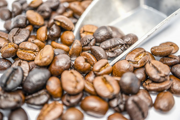 coffee beans with metal scoop