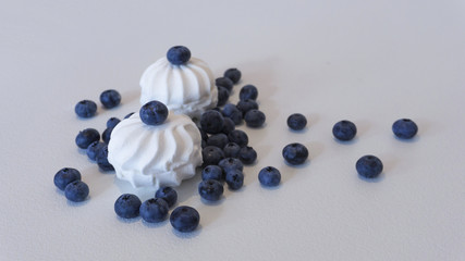 Blueberries and cranberries, berries on a white background. Berry light background.