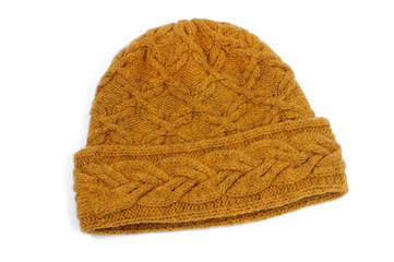 Knitted cap handmade on a white background. View from above.