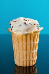 ice cream cone with the last bit on a blue background
