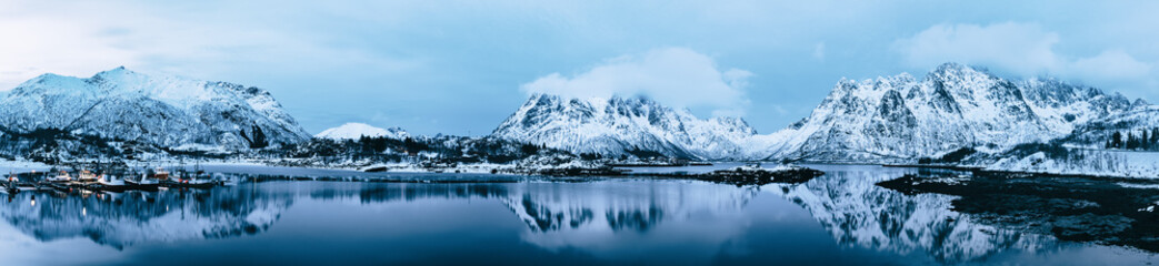 Landscape with beautiful winter lake and snowy mountains at Lofoten Islands in Northern Norway....