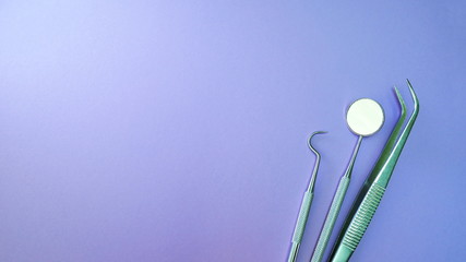 Basic dentist tools isolated on purple or violet background