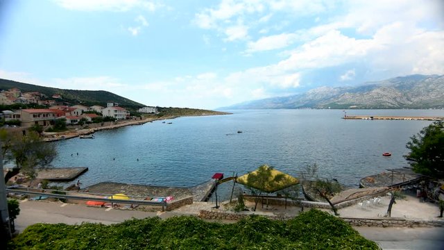View of the sea and mountains of the Vinjerac bay in Croatia during a sunny day