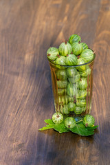 Fresh harvest of gooseberries in a glass