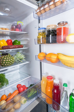Open fridge full of fresh food products