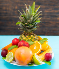 Plate of fresh healthy tropical fruit for dessert