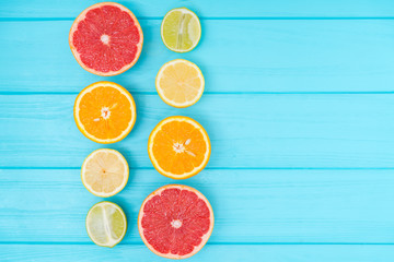 Assortment of halved fresh citrus fruit