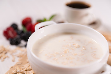 Bowl of oats breakfast cereal with milk