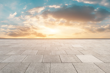Clean square floor and beautiful colorful sky clouds at sunrise