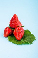 juicy fresh strawberry on a delicately blue background