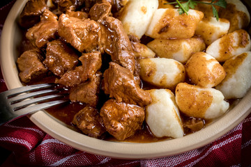 Beef stew with potatoes dumplings.