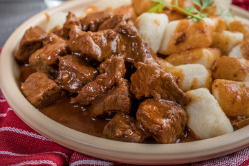 Beef stew with potatoes dumplings.