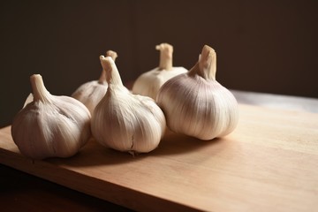 Garlic on wooden plate