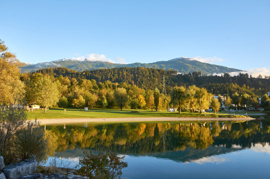 Beautiful Mountains and a lake in autumn. Baggersee, Innsbruck, Austria. © Trambitski