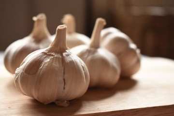 Garlic on wooden plate