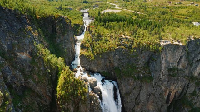 Tilt dawn shot: The famous waterfall Voringsfossen in Norway. Impressive beauty of Scandinavian nature