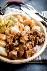 Beef stew with potatoes dumplings.