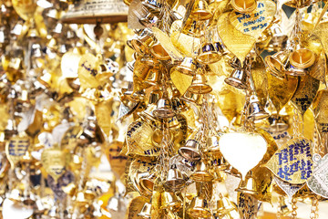 A small number of gold and silver bells were hung for blessings measured in faith.