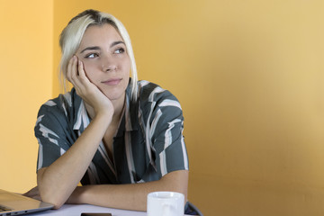young girl thinking in office