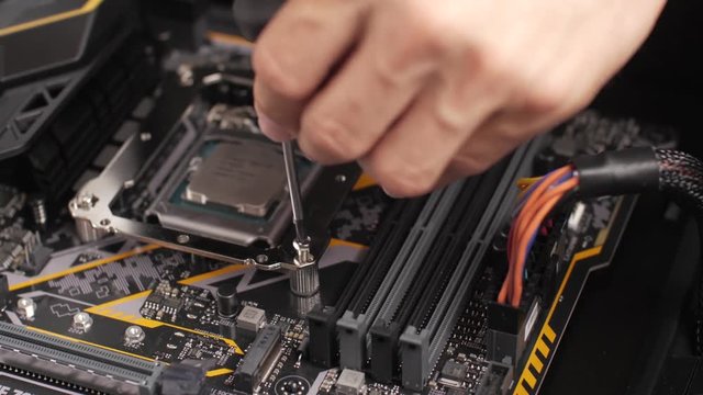 Professional man repairing and assembling a computer desktop