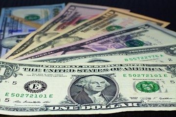 US Banknotes - Stored dollars of different denominations next to each other.