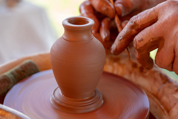 Fototapeta na wymiar Clay jug on pottery wheel.