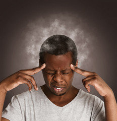 Exhausted black man with steaming head