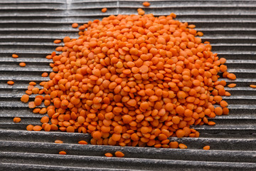 raw lentils on a wooden rustic background