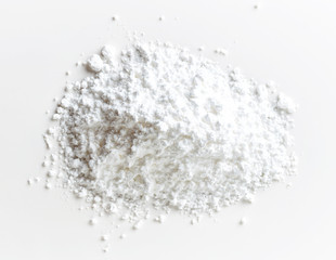 Fototapeta na wymiar Heap of powder sugar on white background, from above