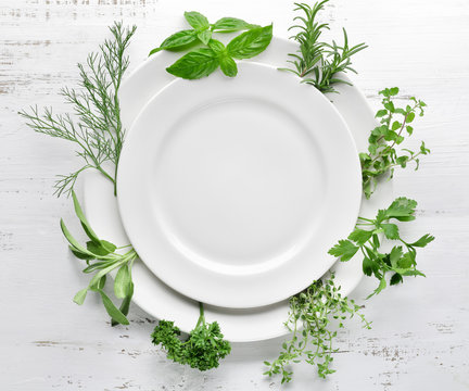 Empty plate with herbs