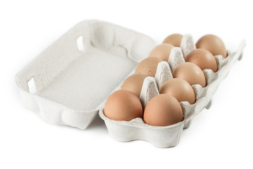 Open box full of eggs, isolated on white background