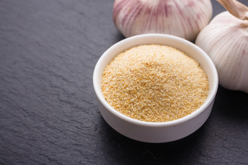 fragrant garlic on a dark stone background
