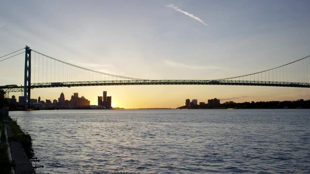 Static Golden Sunrise Over the Detroit River and Bridge