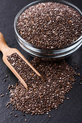 chia seeds on a dark stone background