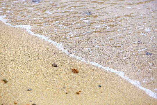 Soft waves of the sea on the sand beach