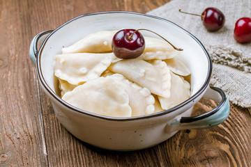 dumplings with cherries on a plate