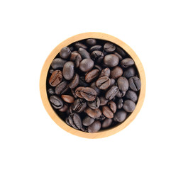 Wooden Bowl with coffee beans and coffee leaf on white background.