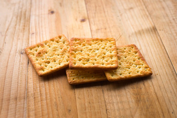 Biscuits crackers on wooden table. selective focus.
