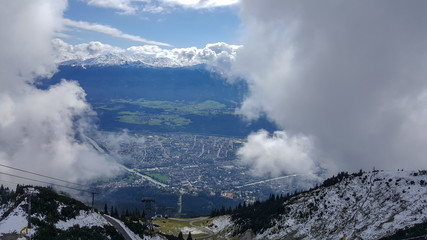 Fototapeta na wymiar When clouds break and clear the Nordkette mountain range you have a view on Innsbruck