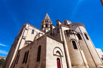 Obraz premium St Paul‘s Church Gothic church with one spire and rose window in Nimes. Gard, Provence, France, Europe