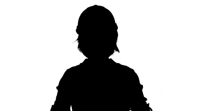 Silhouette Female engineer standing and talking to a camera track matte
