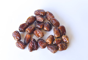 dried dates isolated on white background. selective focus.