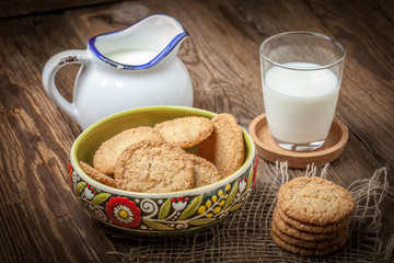 Stack of freshly baked oat biscuits in a bowl.