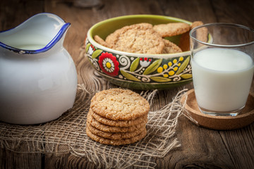 Stack of freshly baked oat biscuits in a bowl.